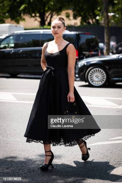 Margo Hayes wears a black midi skirt, black Dior bag and heels,